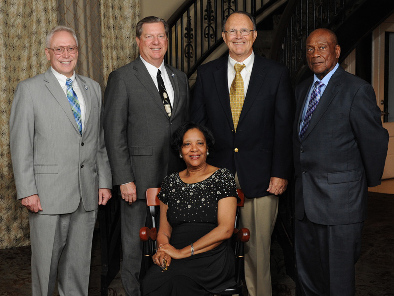 Triplett was elected as the 2015 Friend of the School of Dentistry. Behind her are four of the deans she served, from the left, Dr. Gary Reeves, Dr. James Hupp, Dr. Butch Gilbert and Dr. Willie Hill.