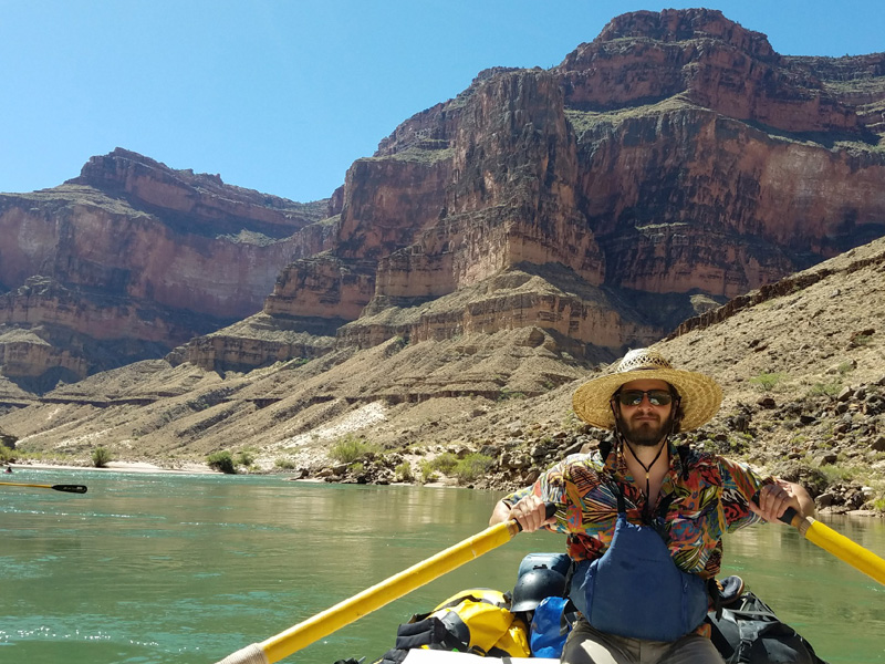 Sunglasses and a hat can protect William Salaun from the blazing sun, if not the seething river.