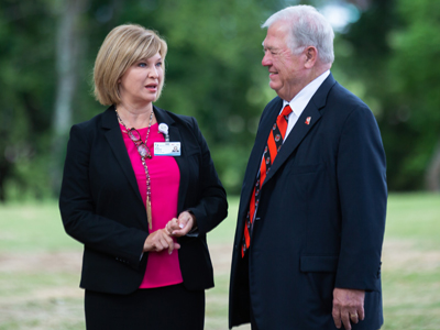 Dr. LouAnn Woodward, vice chancellor for health affairs and dean of the School of Medicine, chats with former Gov. Haley Barbour at groundbreaking ceremonies for the Mississippi Center for Emergency Services.