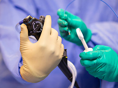 Senitko and Abraham prepare equipment used to explore Simpson's pleural space.