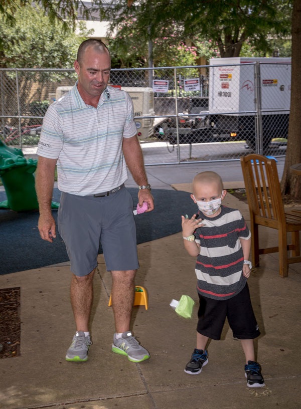 2017 Sanderson Farms Championship winner Ryan Armour plays in the Rainbow Garden with Batson Children's Hospital patient Harlan Harper of Sandy Hook. This year's tournament is set for Oct. 22-28 at the Country Club of Jackson.