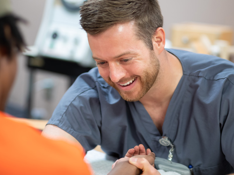 Physical therapist Cody Pannell divides his time between seeing patients at the University Pavilion and teaching at the School of Health Related Professions.