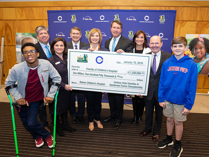 Celebrating a $1.25 million donation from Century Club Charities are, from left, Children's of Mississippi patient Jordan Morgan, Steve Jent, Melanie Morgan, Guy Giesecke, Dr. LouAnn Woodward, Jeff Hubbard, Dr. Mary Taylor, Sanderson Farms CEO and board chair Joe Sanderson Jr. and patient Felton Walker.