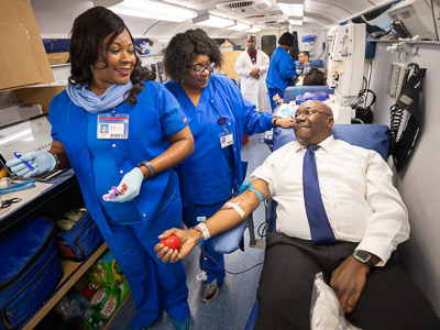 Claude Brunson donating blood.