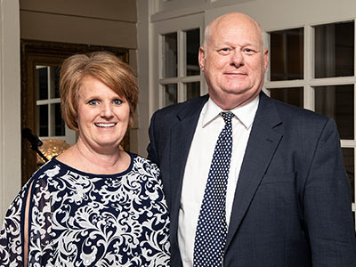 Scarbrough and his sister pose for a photo.