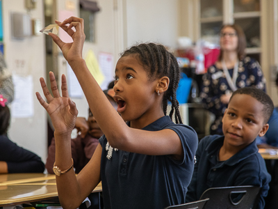 Barack H. Obama Magnet School fourth-grader Kennedi Bolden, 9, finds a rainbow using a glass prism. The lesson was part of Project REACH, an education program with the School of Graduate Studies in the Health Sciences.