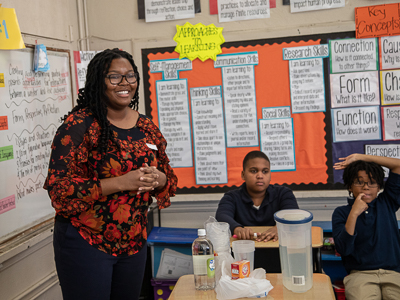 Graduate student Adesuwa Ekunwe leads a lesson at Barack H. Obama Magnet School.