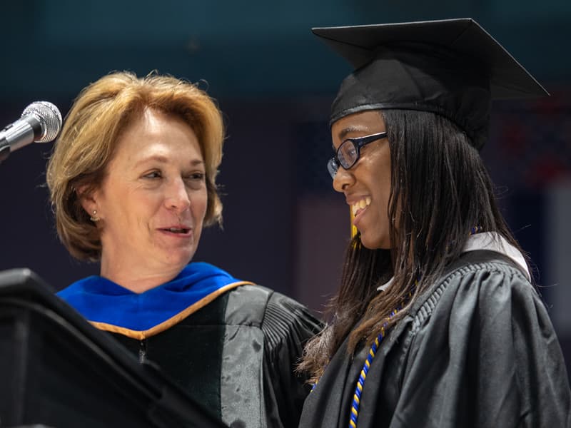 Bachelor of Science in Radiologic Sciences graduate Aurlivia Deshay Bibbs, right, received the Virginia Stansel Tolbert Award from Dr. Jessica Bailey, dean of the School of Health Related Professions.