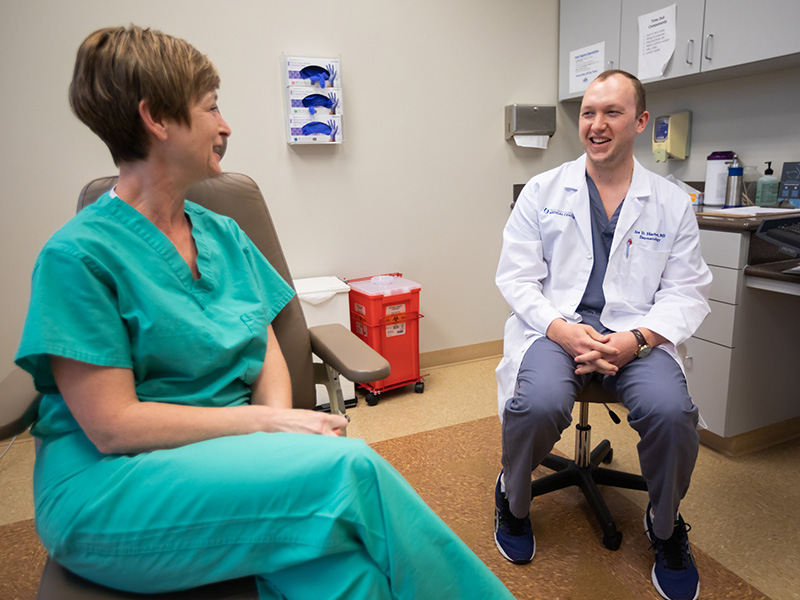 Dermatology resident Dr. Ira Harber consults with patient Kathryn Carter at the Department of Dermatology's Face and Skin Clinic in Ridgeland.