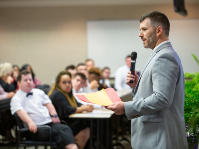 Casey Bridges, Project SEARCH coordinator at UMMC, speaks at the program's graduation ceremony.