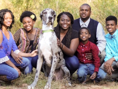 From left to right, Tamera Hall, Fumilayo Hall, Zeus, Olubusola Hall, Dewayne Hall, Adewale Hall, and Dewayne Hall Jr.