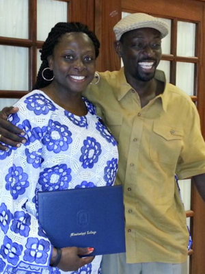 Olubusola Hall, left, and her brother Oluwaseun at Hall's graduation from nursing school at Mississippi College in 2015.