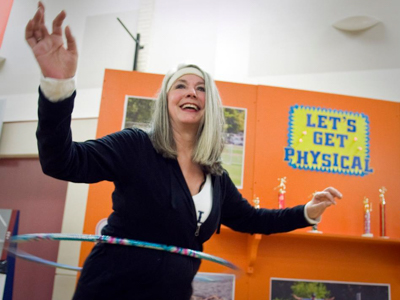 Janet Harris hula hoops at Taste of the U, an annual culinary event that benefited the UMMC Alliance's Patient Needs Fund.