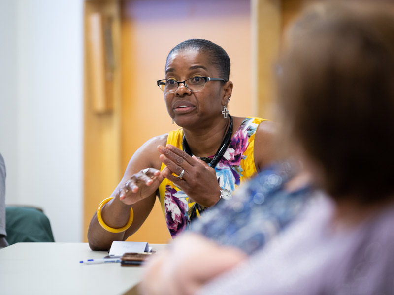 Darlene Johnson of Jackson, a first-time visitor to the UMMC Alzheimer's Support Group, asks a question of Meng.