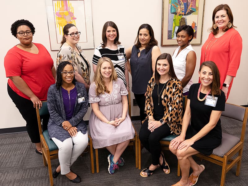 Cole takes a moment for a group photo with her staff, front row from left, Brittney Anthony, student admissions officer II; Lauren Nichols, student admissions officer II; Felicity Broderick, student admissions officer II; and Elizabeth Collins, student admissions officer II; and back row from left, Hattie Pinson, student records specialist; Christi Hardy, assistant director of student records; Tressie Nichols, student admissions officer II; Melissa Haydel, senior student records specialist; and Sarah Jefferson, student admissions officer II. 