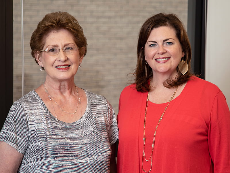 Barbara Westerfield, left, wasn't worried at all about handing the registrar reins to Emily Cole.