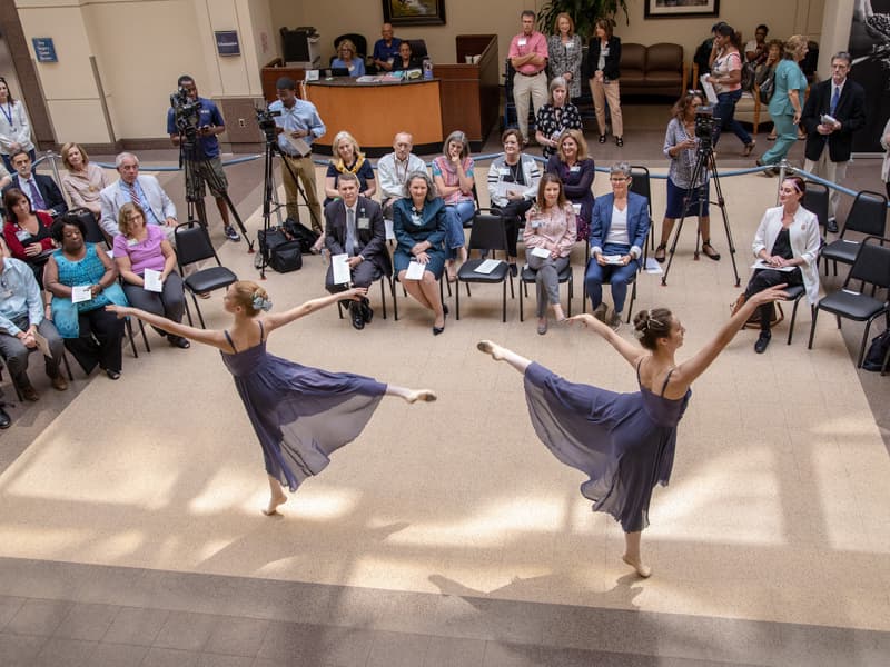 Dancers from Ballet Mississippi perform a selection for an audience of about 100 people gathered in the main lobby of the Medical Center.