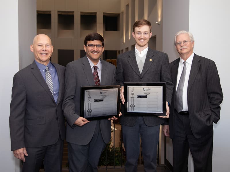 Inventors Dr. Amol Janorkar and Jared S. Cobb with their non-provisional patent application, "Method for the Production of Precisely Sized Macro- and Micro-ELP Containing Particles for the Delivery of Therapeutic Agents." Dr. John Correia and Dr. Valeria Zai-Rose, not present, are co-inventors.