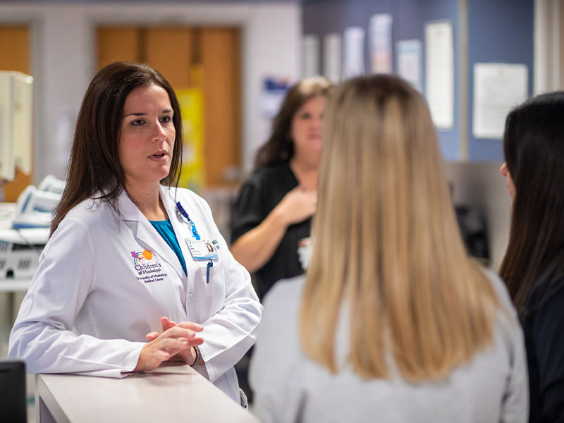 Dr Lisa Didion, center, with Registered Nurses Lauren Girod, left, andMegan Roberts. Dr Lisa Didion, left, speaks with Registered Nurses Lauren Girod, center, and Megan Roberts.