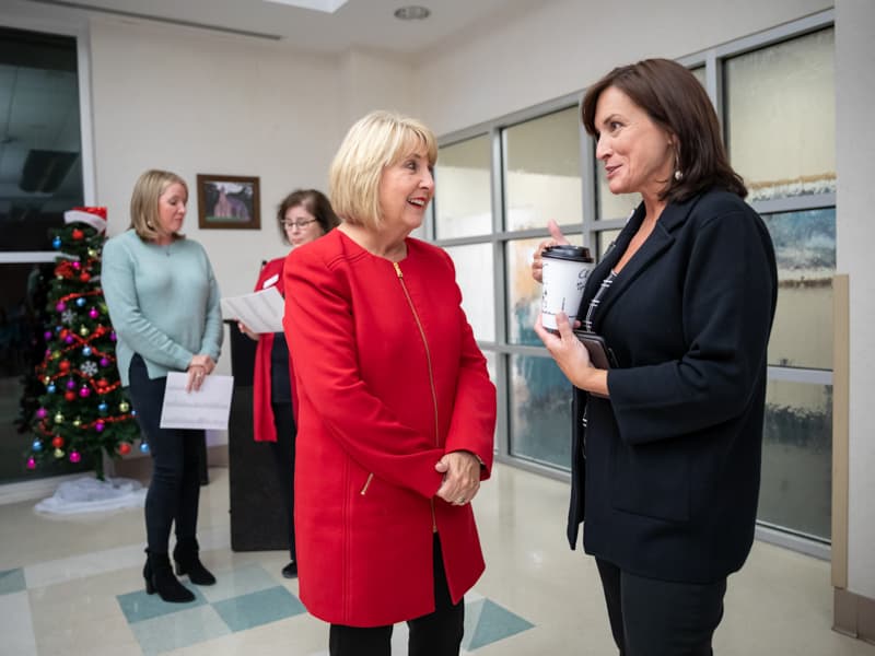 Bryant, left, and Dr. Mary Taylor, UMMC pediatrics chair, chat before the start of the event.