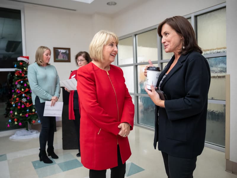 Bryant, left, and Dr. Mary Taylor, UMMC pediatrics chair, chat before the start of the event.