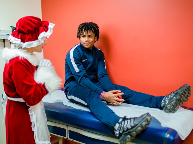 JeWillam Stewart of Forest gets a visit from Mrs. Claus at the Children's of Mississippi Emergency Department.