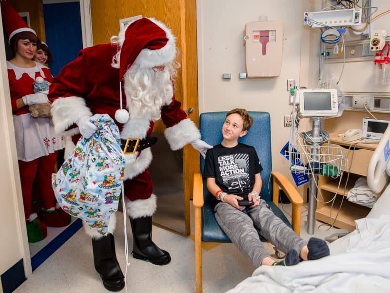 Children's of Mississippi patient Ty Foster of Sumrall gets a surprise visit from Santa Claus.