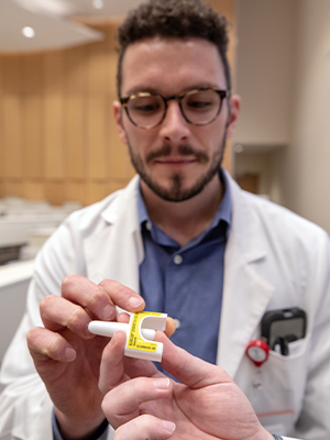 Medical student holds narcan nasal spray.