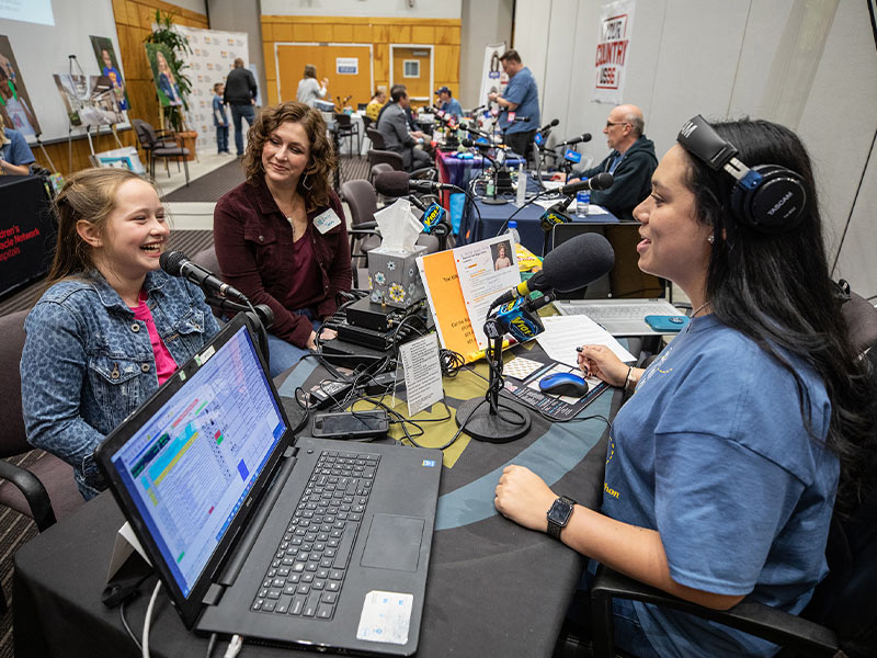 Children's of Mississippi patient Magnolia Jones of Bogue Chitto talks with Y101's Megan Macko as mom Emily Jones looks on.