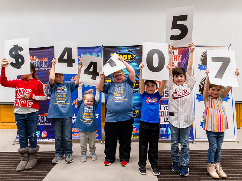 The total raised in the 19th annual Mississippi Miracles Radiothon is $441,057, and all of the funds will stay in Mississippi to benefit the state’s only children’s hospital. Revealing the sum are, from left, Savannah Grace Hendricks, Tucker Jones, Olivia Jones, Blake Stone, Jaxson Hemby, Brees Davis and Rorie Jane Davis.