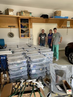 UMMC CRNAs Josh Fuqua, Maggie Ryals, and Wade May with a set of ventilators they built with Dr. Charles Robertson.