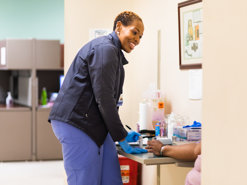 Clinical pharmacist Erika Webster collects a blood specimen at the Jackson Medical Mall anticoagulation clinic. 