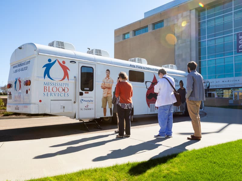 Mississippi Blood Services is working with UMMC to collect blood plasma donations from approved participants for the COVID-19 study. Here, the MBS Donor Coach parked outside the School of Medicine in 2019.