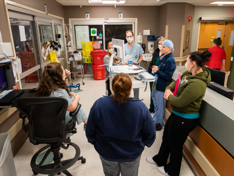 Teams comprised of attending physicians; residents and fellows; pharmacists; social workers; interns; and nurse practitioners make daily rounds in the medical ICU.
