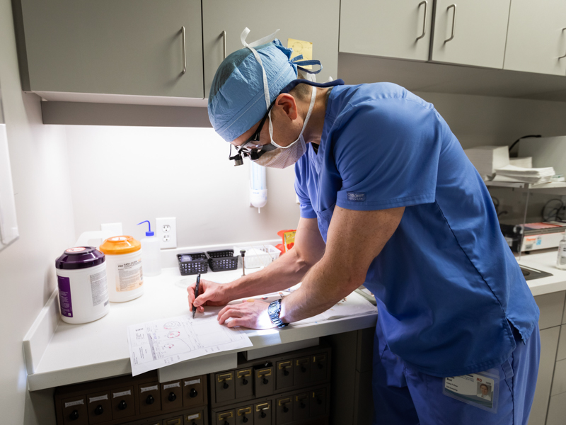 Black, associate professor of dermatology, works in the lab during a Mohs procedure at the Skin Cancer Center's new space.