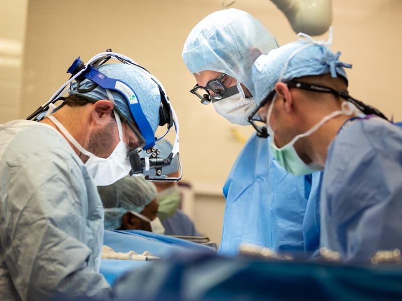 From left, Dr. Brian Kogon, Dr. Mohammed Ghanamah and nurse practitioner Craig Mathis perform a cardiac procedure.