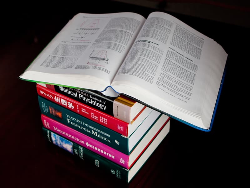 Textbooks stacked on top of one another