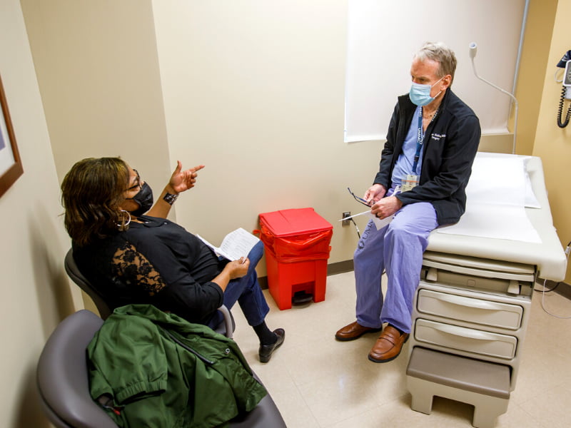 UMMC general surgeon Dr. Thomas Helling discusses a procedure with patient Morise Moore Hines of Madison.