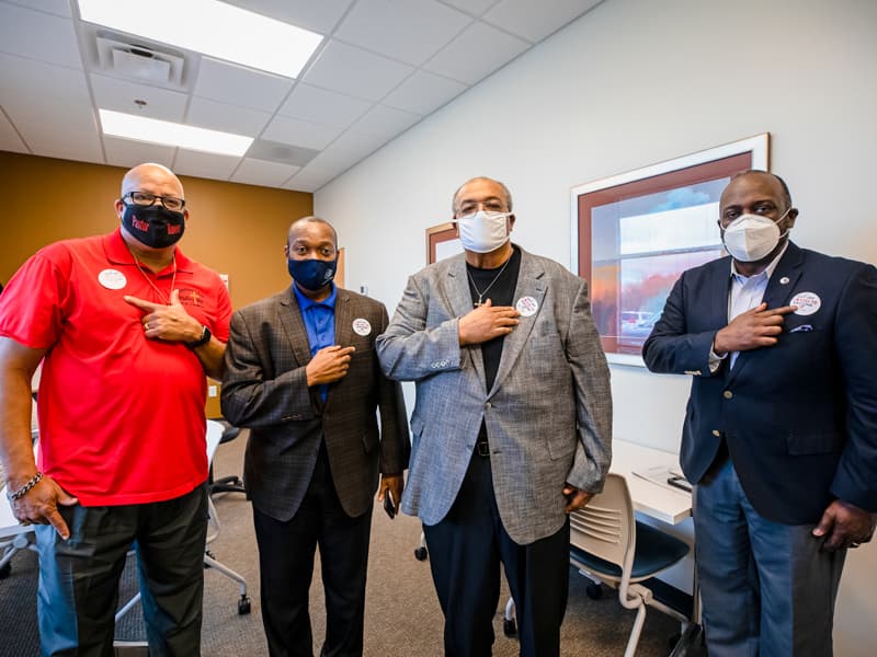 Showing off their "I got my COVID-19 vaccine" stickers, are, from left, pastors Rouser, Montgomery, Earnest Ward and Reginald Buckley.