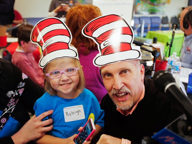 Mix 98.7 program director John Anthony, a perennial Mississippi Miracles Radiothon broadcaster, smiles with Children's of Mississippi patient Ryleigh Sayers, during the 2016 Mississippi Miracles Radiothon.