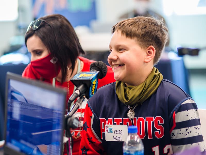 Lucas Mann of Brandon and his mother, Faith, enjoy chatting on the air with radio personalities.