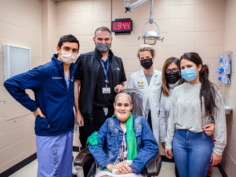 Celebrating the successful cancer surgery for Almarie Maldonado Pagan, seated, are from left, surgeons Dr. Ignacio Velasco-Martinez, Dr. Benjamin McIntyre and Dr. Laura Humphries; Almarie;s mother, Maria Pagan; and Almarie's sister, Laura Maldonado Pagan.