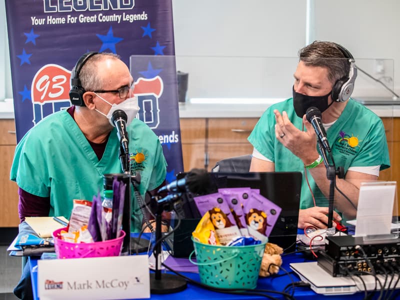 Mark McCoy, left, and Scott Steele, veteran Mississippi Miracles Radiothon broadcasters, talk on air.