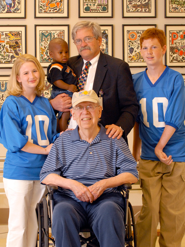 Batson is shown with Dr. Owen “Bev” Evans, who was the Medical Center’s second chair of pediatrics following Batson’s retirement, and patients.