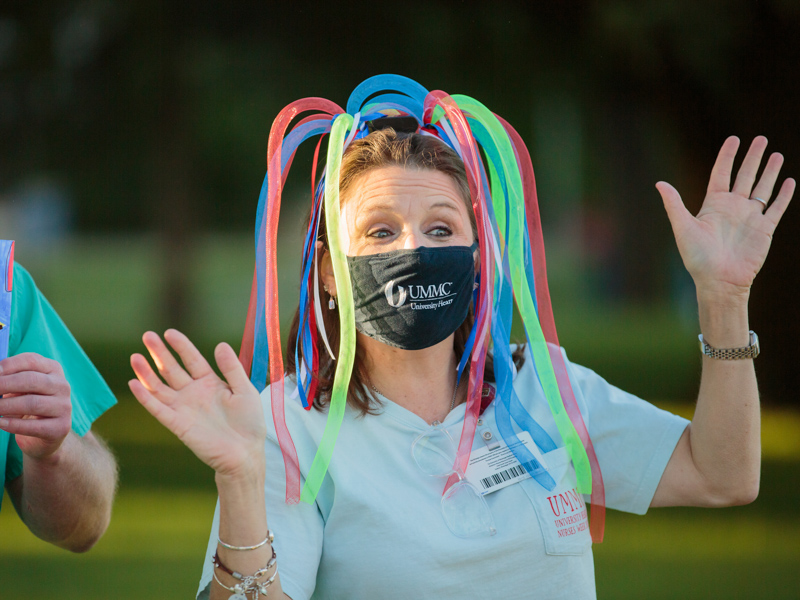 University Heart executive director Camille Richards cheers on dozens of UMMC employees as they enter campus May 7 during the kickoff for Employee Appreciation Week.