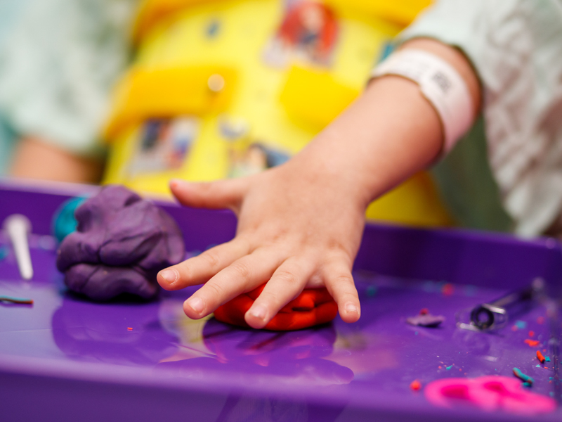It may look like Elena is just sculpting with Play-Doh, but her brain and fingers are getting a workout while she heals.