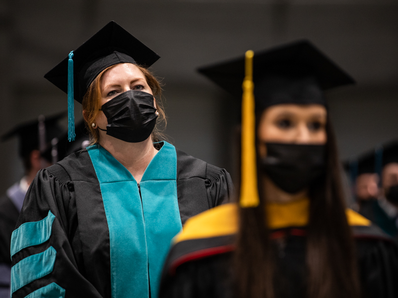 UMMC registrar Emily Cole, left, received her Doctor of Health Administration during May 28 commencement at the Mississippi Coliseum.