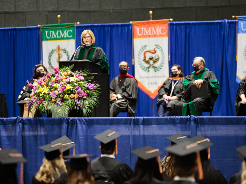 Dr. LouAnn Woodward, vice chancellor for health affairs and dean of the School of Medicine, addresses graduates during commencement for the School of Nursing.