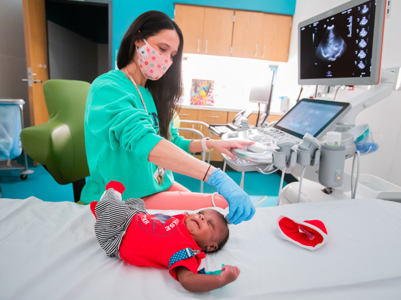 Sonographer Leslie Webb gives patient Da'Quan Griffin of Lexington an ultrasound.