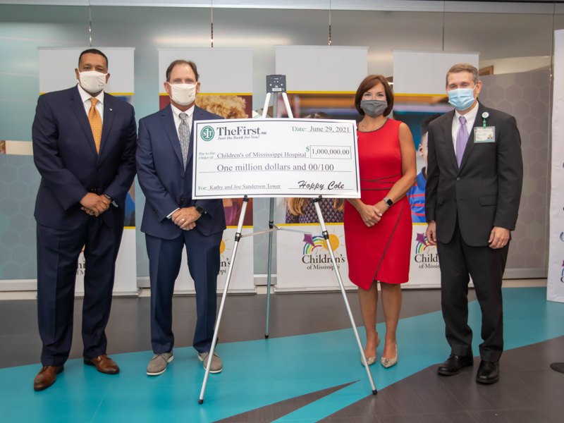 Announcing a $1 million gift from The First, A National Banking Association, to the Campaign for Children's of Mississippi are, from left, C. Jerome Brown, executive vice president of The First; M. Ray “Hoppy” Cole, president and CEO of The First; Dr. Mary Taylor, Suzan B. Thames Chair, professor and chair of pediatrics; and Children's of Mississippi Guy Giesecke.